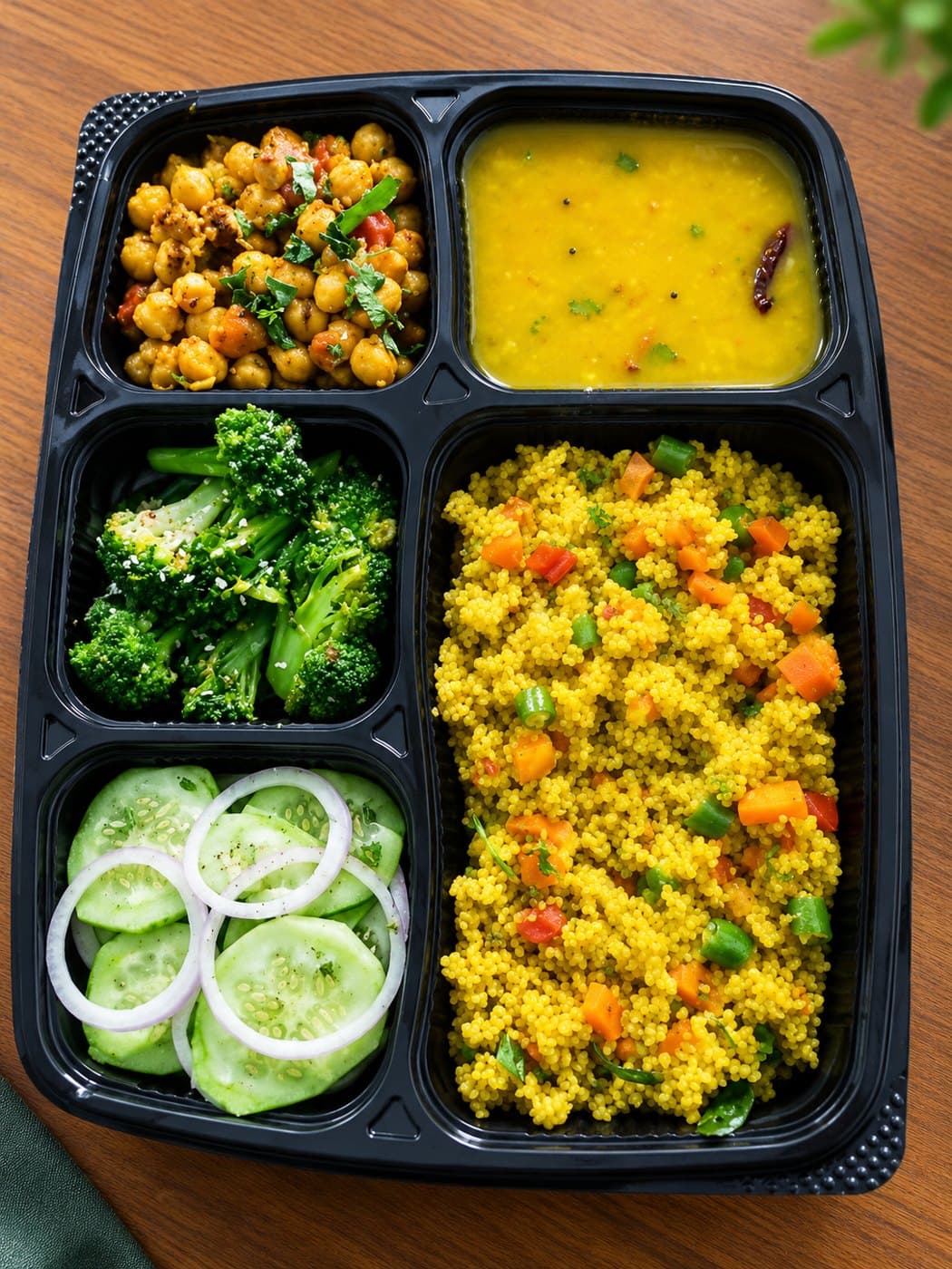 Kefilo meal with fresh vegetables and grains